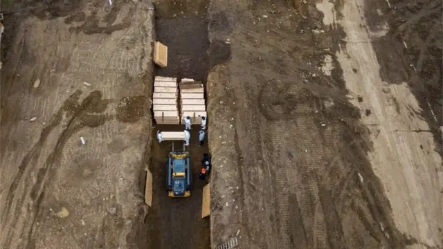Drone pictures show bodies being buried on New York"s Hart Island where the department of corrections is dealing with more burials overall, amid the coronavirus disease (COVID-19) outbreak in New York City,