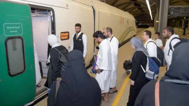 Passengers boarding a train at Mecca train station