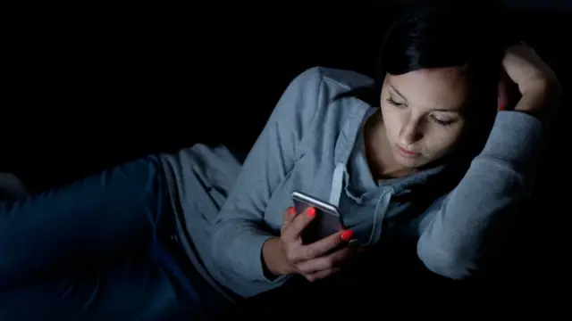 Young woman looking at a mobile phone