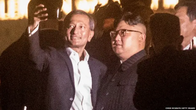 Singapore Minister for Foreign Affairs Vivian Balakrishnan (L) takes a selfie with North Korean leader Kim Jong-un