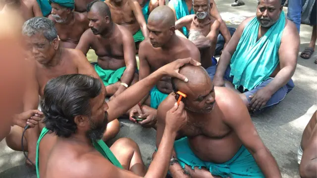 மொட்டை அடித்து போராட்டம்