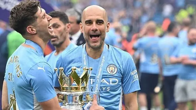 Pep Guardiola celebrates winning the Premier League