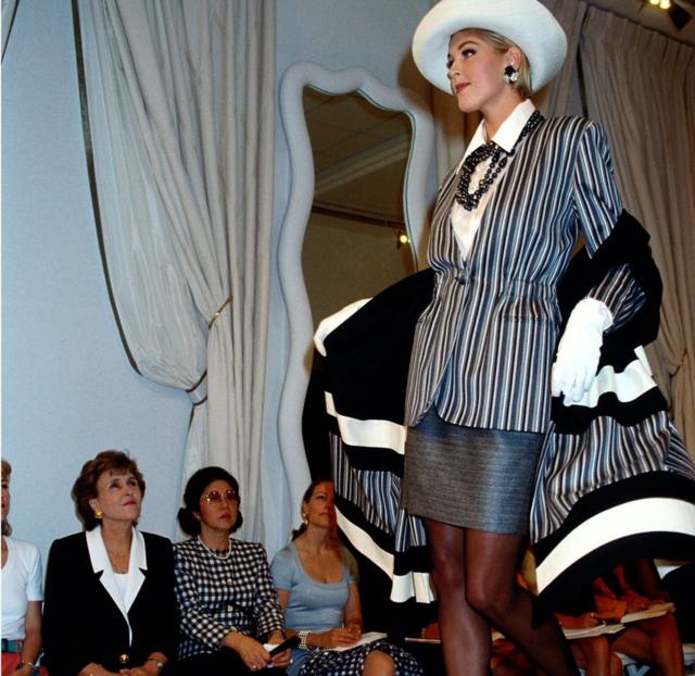 Hanae Mori and French Prime Minister Edith Cresson as they watch a model wearing one of Mori's designs on the catwalk in Paris in July 1991