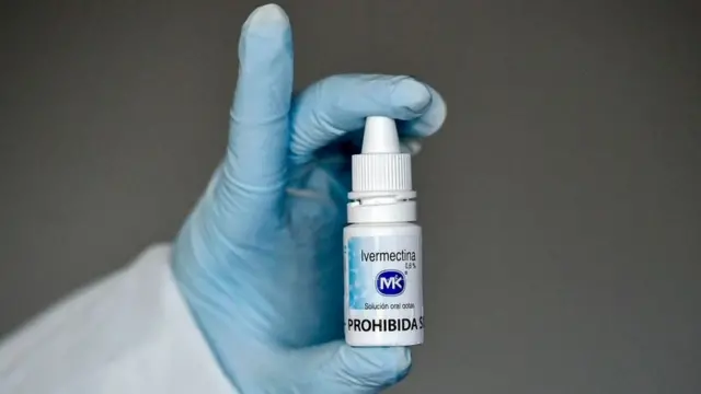 A health worker shows a bottle of Ivermectin, a medicine authorized by the National Institute for Food and Drug Surveillance (INVIMA) to treat patients with mild, asymptomatic or suspicious COVID-19, as part of a study of the Center for Paediatric Infectious Diseases Studies, in Cali, Colombia, on 21 July 2020.