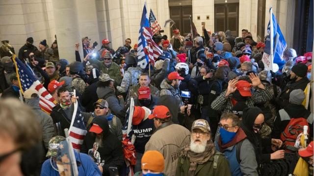 Protesters supporting Donald Trump gather near the east front door of the US Capitol after groups breached the building's security on January 6, 2021 in Washington, DC