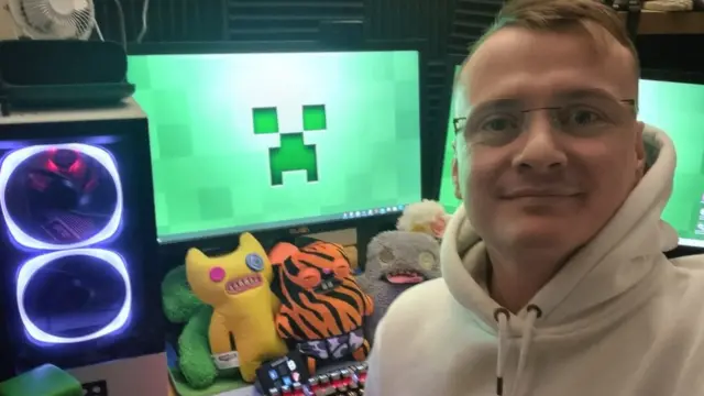 Richard Turner by a computer smiling