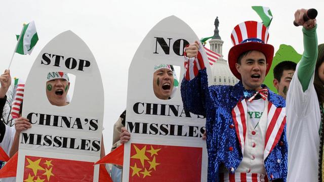 Taiwanese-Americans demonstrate 26 March, 2005, near the US Capitol (rear) in Washington, DC, to protest China's anti-secession law. The controversial anti-secession law, passed by the Chinese parliament last week, authorizes the use of military force against Taiwan if the island moves toward formal independence.