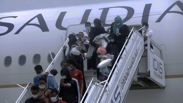 Ethiopian migrants returned from Saudi Arabia arrive at Bole International Airport in Addis Ababa, Ethiopia on July 7, 2021
