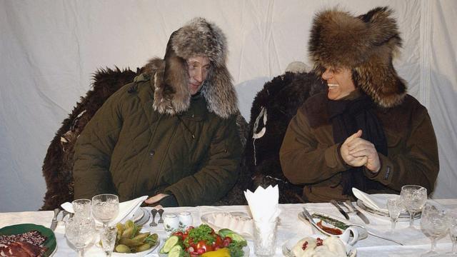 Putin and Berlusconi in warm winter outfits on a trip to a wildlife preserve north of Moscow in 2003
