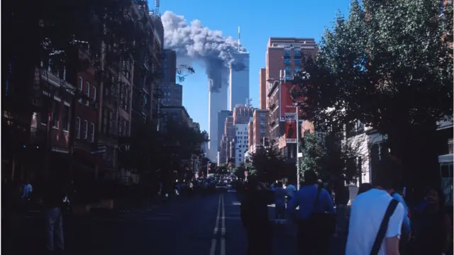 Smoke from the burning World Trade Center towers fills up the downtown Manhattan skyline