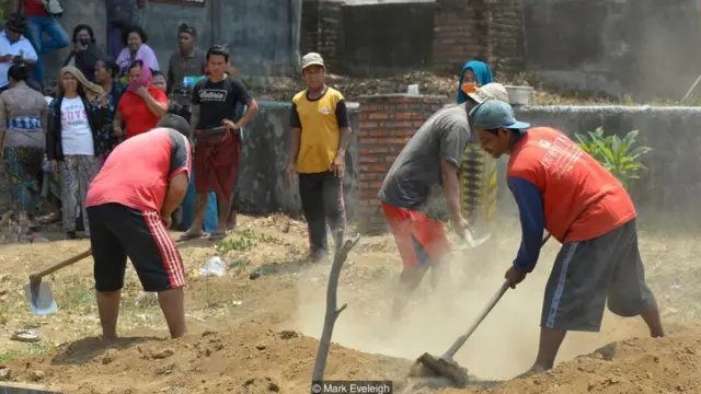 Bengkala's kolok community often find work as security guards and gravediggers because of their reputation for being brave