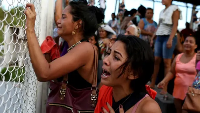 Relatives of dead inmates at a prison complex in the Brazilian state of Amazonas, 27 May 2019