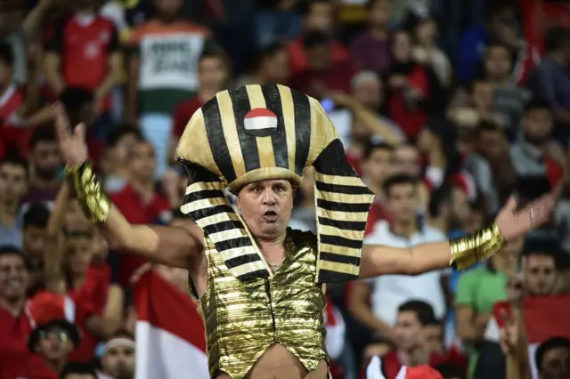 Egyptian fans cheer for their national team during the FIFA World Cup 2018 qualification football match between Egypt and Uganda at the Borg al-Arab Stadium near Alexandria on September 5, 2017.