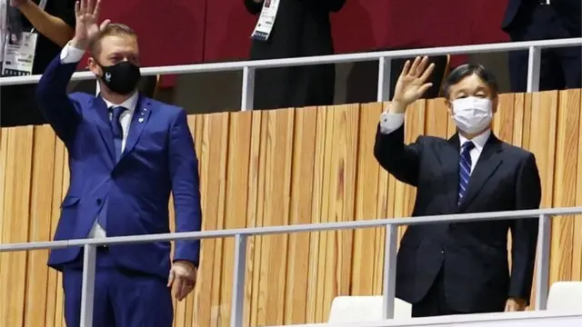 The Tokyo 2020 Paralympic Games Opening Ceremony - Olympic Stadium, Tokyo, Japan - August 24, 2021. International Paralympic Committee president Andrew Parsons and Japan"s Emperor Naruhito wave before the opening ceremony