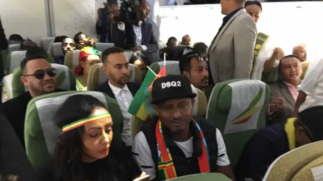 ተጓዦች አውሮፕላን ውስጥ