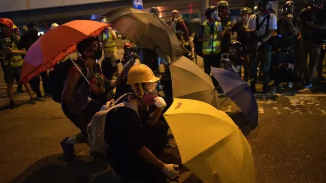 Protesters gather together after a group occupied a main road near the central government offices in the Admiralty area in Hong Kong on September 28, 2019,