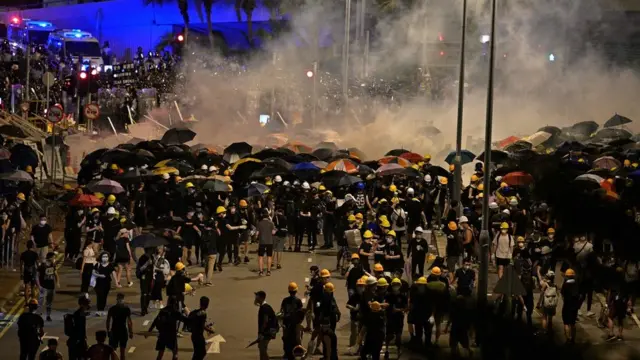 Police fire tear gas at protesters near the government headquarters in Hong Kong on July 2, 2019, on the 22nd anniversary of the city"s handover from Britain to China.