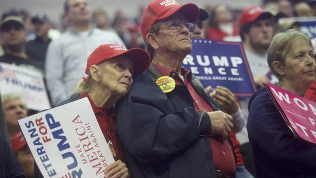 Supporters watch Republican Presidential nominee Donald J. Trump during a rally at Giant Center November 4, 2016 in Hershey, Pennsylvania. Mr Trump would go on and win election day on November 8.