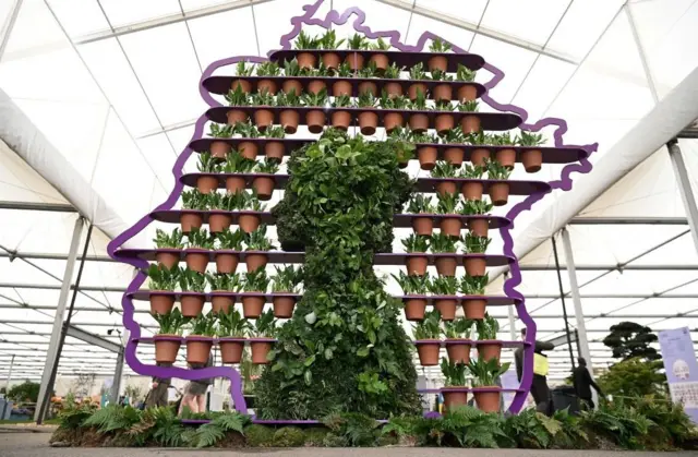 A display created by Simon Lycett in honour of Britain's Queen Elizabeth II, featuring 70 hand-thrown pots - one for every year of the Queen's reign