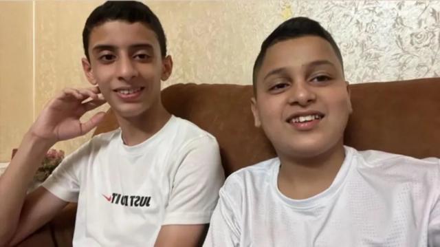 The IDF said Basil, left, was holding an explosive when he was on the street with his friend Baha, right