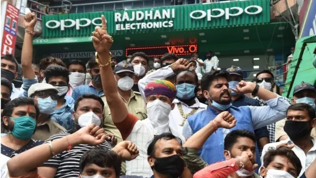 Chief of Gujarat"d Karni Sena Raj Shekhawat (wearing turban C) along with activists shout slogans during an anti-China demonstration at a commercial area in Ahmedabad on June 24, 2020
