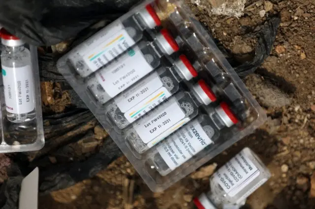 Expired AstraZeneca coronavirus disease (COVID-19) vaccine vials are seen at the Gosa dump site in Abuja, Nigeria on December 22, 2021