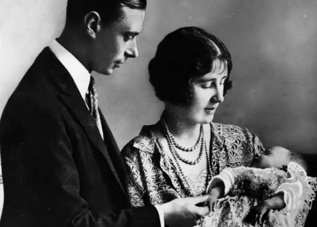 Princess Elizabeth at her christening ceremony with her parents