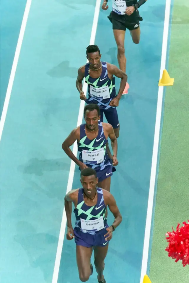 Getnet Wale, Lamecha Girma and Selemon Barega of Ethiopia run in file.