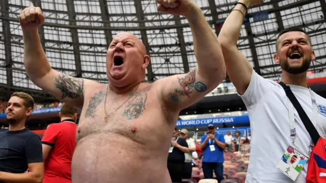 A fan cheers ahead of the semi-final in Russia