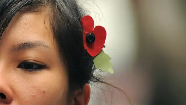 Girl wearing a poppy