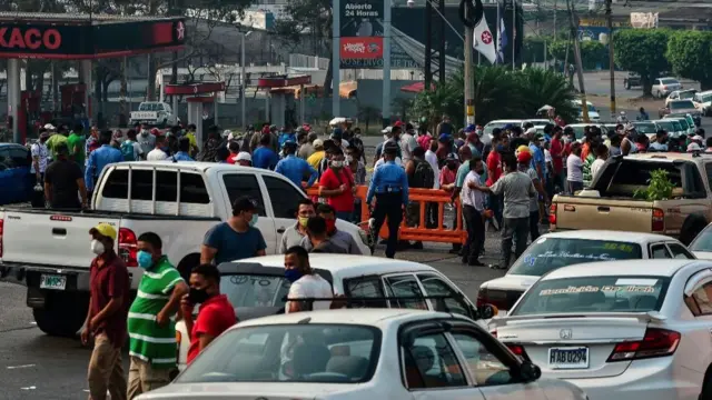 Taxi drivers block a road in protest in Honduras, demanding the government to provide food on 6 May 2020