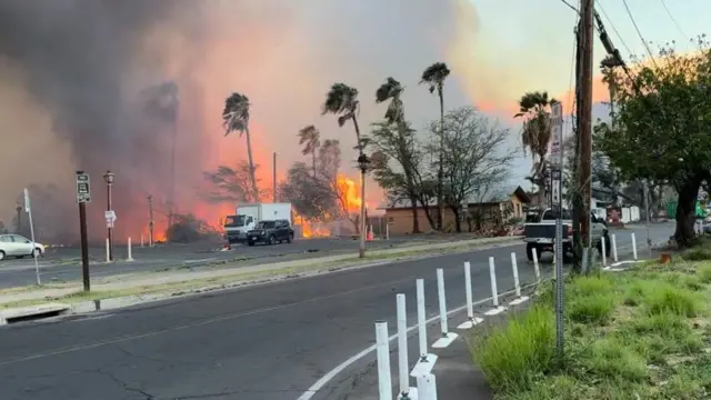 Image shows a fire near a main road