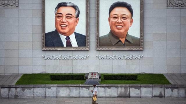 Images of Kim Il-sung and Kim Jong-il adorn every public building in N Korea