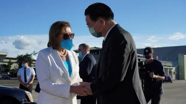 U.S. House of Representatives Speaker Nancy Pelosi talks with Taiwan Foreign Minister Joseph Wu before boarding a plane at Taipei Songshan Airport in Taipei, Taiwan August 3, 2022
