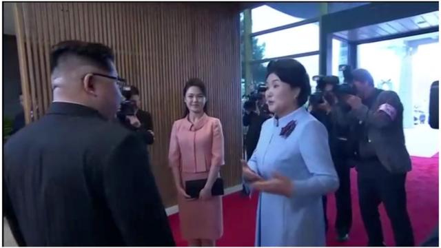 North Korean leader Kim Jong Un"s wife, Ri Sol Ju, arrives to join the inter-Korea dinner at the truce village of Panmunjom, in this still frame taken from video, South Korea April 27, 2018. Host Broadcaster via REUTERS TV