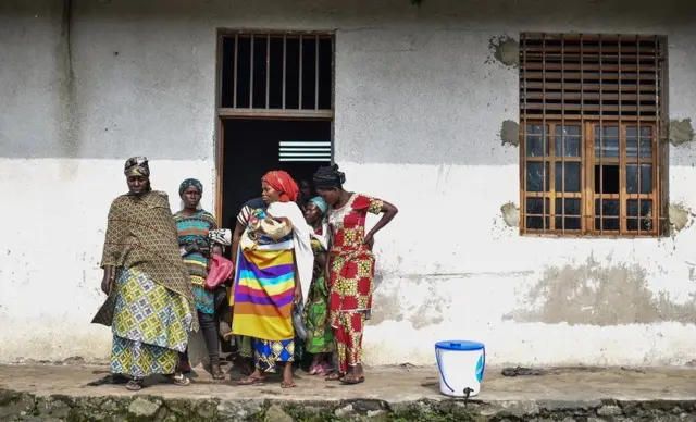 Women standing outside a building