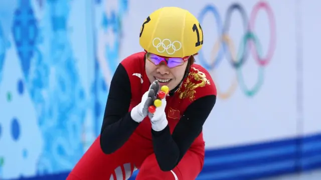 Yang Zhou of China celebrates winning the gold medal during the Ladies' 1500 m Final Short Track Speed Skating on day 8 of the Sochi 2014 Winter Olympics at the Iceberg Skating Palace on February 15, 2014 in Sochi, Russia