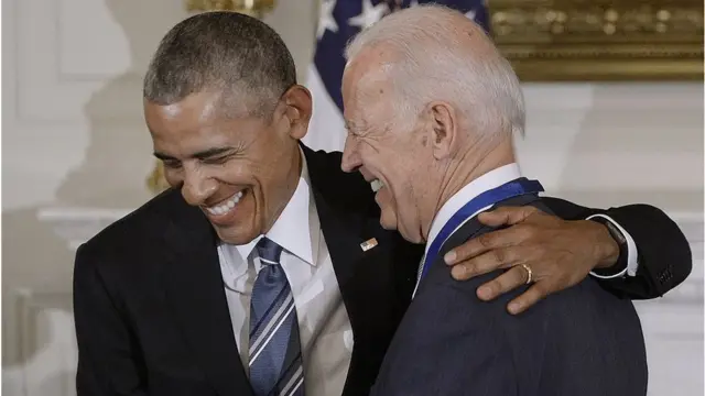 President Barack Obama (R) presents the Medal of Freedom to Vice-President Joe Biden during an event in the State Dinning room of the White House, January 12, 2017