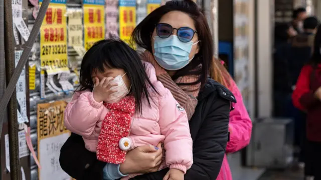 Женщина с ребенком в Гонконге