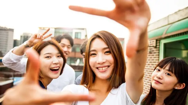 Some young South Koreans having fun on a rooftop party in Seoul.