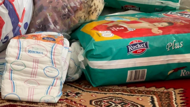 Nappies on the ground in a room at the refuge in Quetta, Pakistan