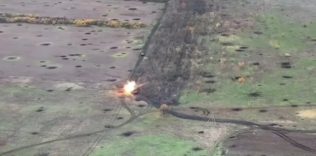 Image from Ukrainian reconnaissance drone showing a Russian armoured vehicle being blown up near Pavlivka