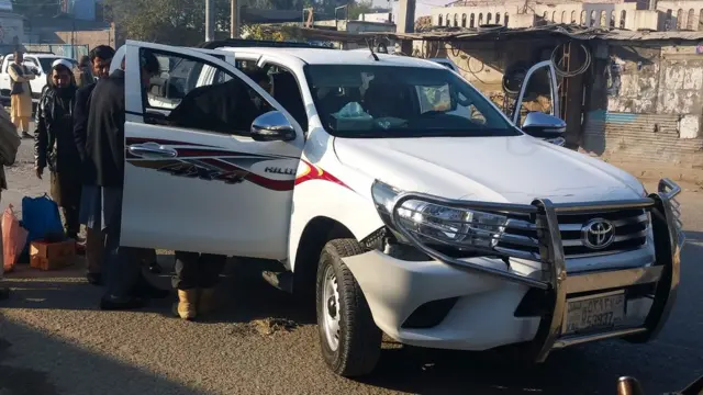 Afghan security force personnel inspect a vehicle, which was carrying Japanese doctor Tetsu Nakamura