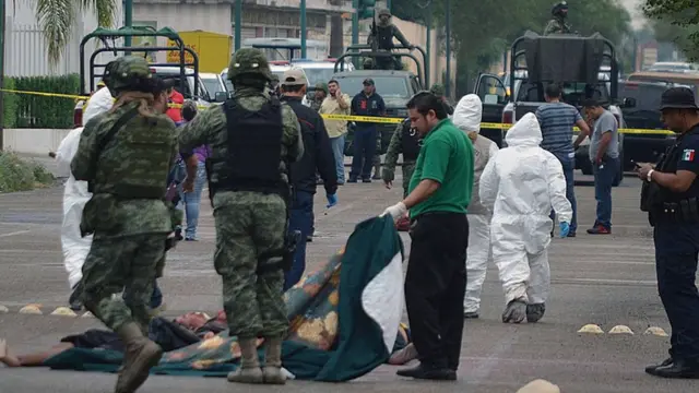 Pessoal militar e forense mexicanojogo para ganhar dinheiro cassinouma cena do crime na cidadejogo para ganhar dinheiro cassinoNuevo Laredo, estadojogo para ganhar dinheiro cassinoTamaulipas.