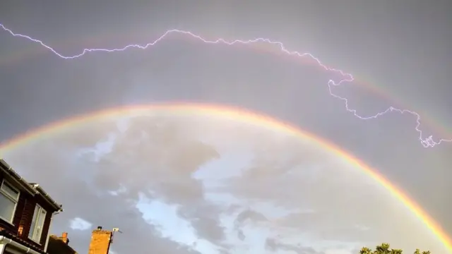 Lightning strikes across a double rainbow in Hednesford, Staffordshire, by Weather Watcher Crezz1993.