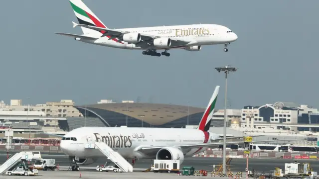 Emirates Airlines Airbus A380 plane approaches for landing at Dubai Airports in Dubai
