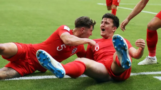England"s Harry Maguire (right) celebrates scoring his side"s first goal of the game with John Stones during the FIFA World Cup, Quarter Final match at the Samara Stadium.