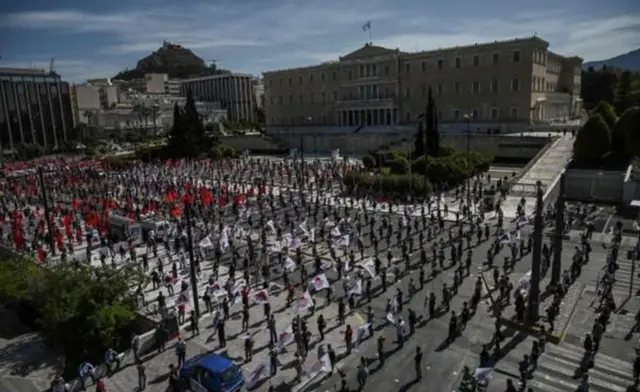 Members of the Greek Labour Union kept their social distance at a rally outside parliament in Athens