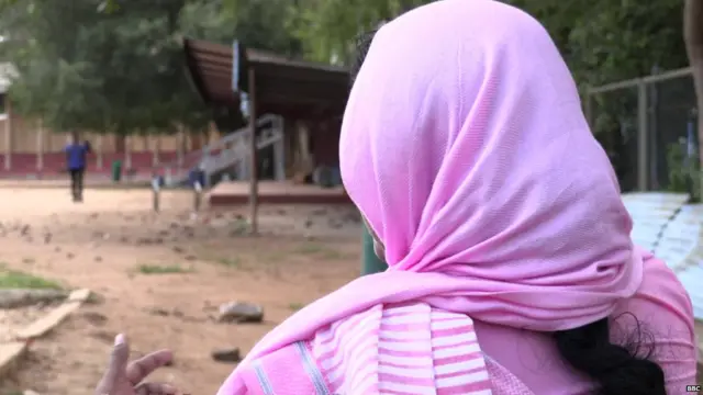 The woman running the community centre where Shafa is getting help hides her identity for protection