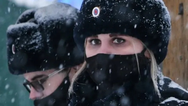 Russian police officers patrol near Listvyazhnaya coal mine in the Kemerovo region near the town of Belovo after an accident on November 25, 2021.
